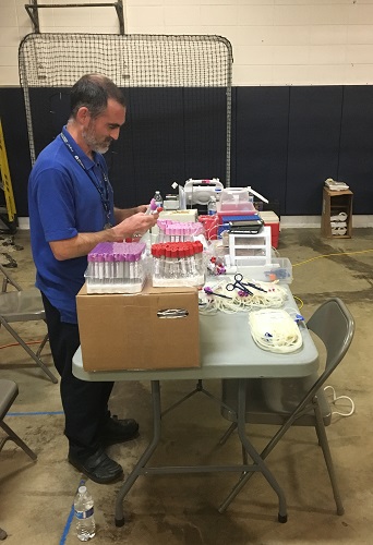 Matt prepares the tubes at the Hillcrest Blood Drive. (10/16)