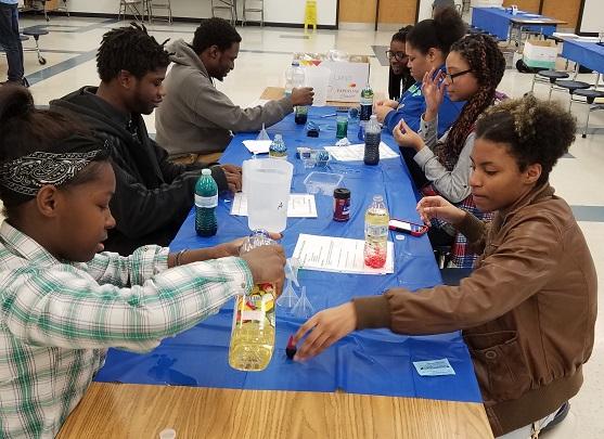 Students use various colors and liquids to make lava lamps at Hillcrest STEM Night 2017.