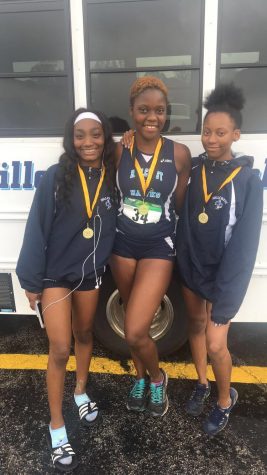 Teya Lewis,Gloria Agblami, & Aniya Matthews show off their medals after the Colonel Madden Cross Town Meet in Oak Forest. (10/6/18) 